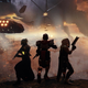 Destiny 2 Guardians look out at the Last City under siege by Cabal.